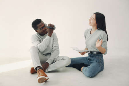 Young international people working together and use the cameraの写真素材