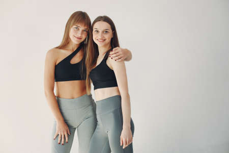 A beautiful girls is engaged in a yoga studioの写真素材