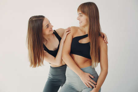 A beautiful girls is engaged in a yoga studioの写真素材