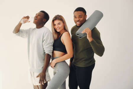 Sports group standing on a white backgroundの写真素材