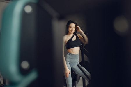 A beautiful girl is engaged in a gym