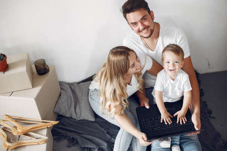 Family moving and using a boxesの写真素材