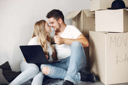 Couple moving and using a boxesの写真素材