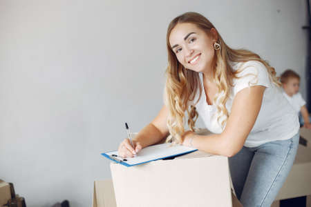 Woman moving and using a boxesの写真素材