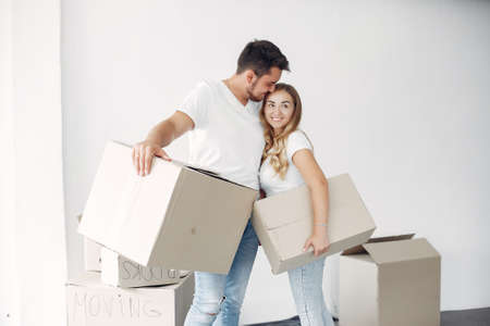 Couple moving and using a boxesの写真素材