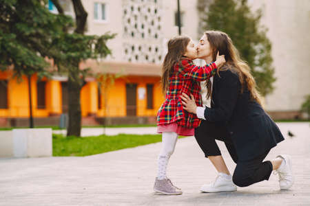Mother and daughter in a sprong cityの写真素材