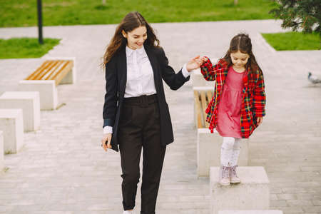 Mother and daughter in a sprong cityの写真素材