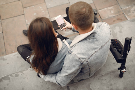 Beautiful couple spend time in a autumn cityの写真素材