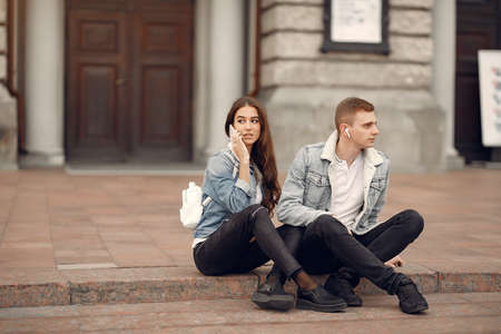 Beautiful couple spend time in a autumn cityの写真素材