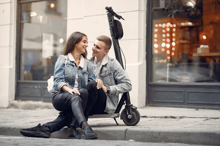Beautiful couple spend time in a autumn city
