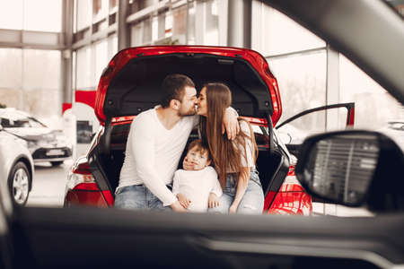Family with little son in a car salonの写真素材