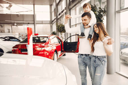 Family with little son in a car salonの写真素材