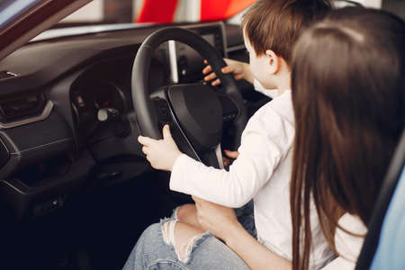 Stylish and elegant woman in a car salonの写真素材