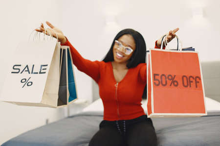 African woman online shopping at homeの写真素材