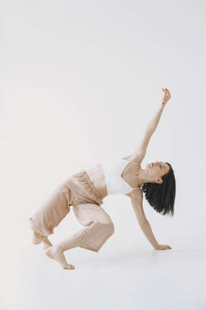 Beautiful young woman dancing in studioの写真素材