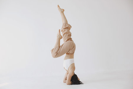 Beautiful young woman dancing in studio