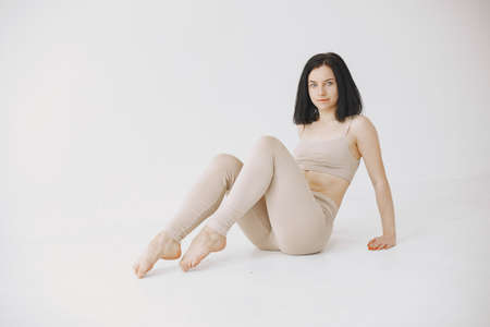 Beautiful young woman dancing in studioの写真素材