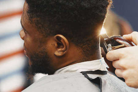 Young African-american man visiting barbershopの写真素材