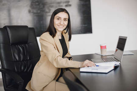 Portrait of a confident black businesswoman working at officeの写真素材