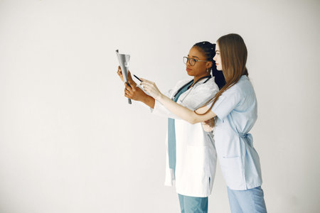Two female doctors looking at an x-ray