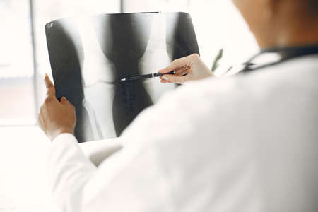 Two female doctors looking at an x-rayの写真素材