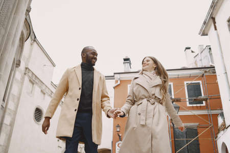 Mixed couple spenting time together in a spring cityの写真素材