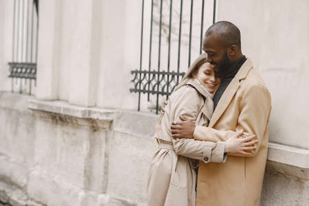 Mixed couple spenting time together in a spring cityの写真素材