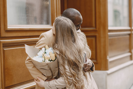 Mixed couple spenting time together in a spring cityの写真素材