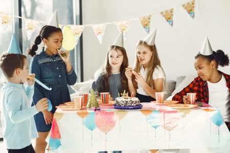 Group of kids celebrate birthday partyの写真素材
