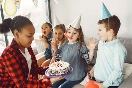 Group of kids celebrate birthday partyの写真素材