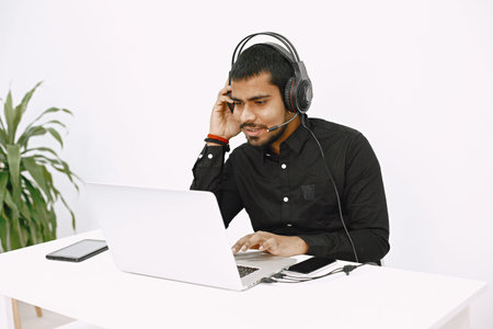 Indian businessman working at desk in office