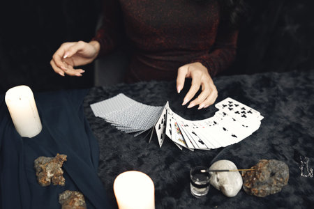 Portrait of fortune-teller in a dark room