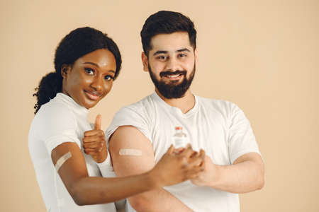 People showing thumbs up after getting  vaccineの写真素材