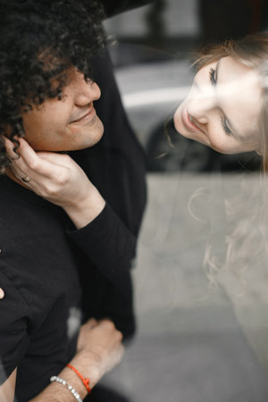 Mixed couple spenting time together in a cafeの写真素材