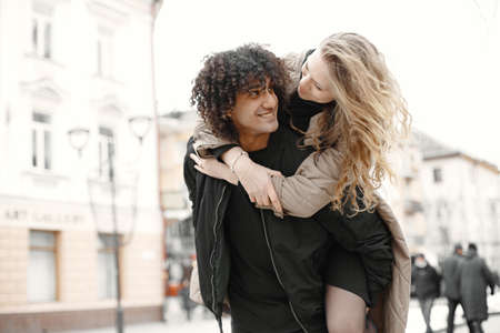 Mixed couple spenting time together in a spring cityの写真素材