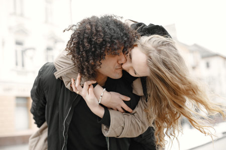 Mixed couple spenting time together in a spring city