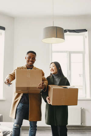 Couple unpacking boxes at their new homeの写真素材