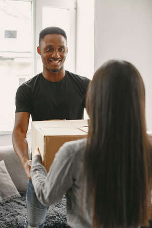 Couple unpacking boxes at their new homeの写真素材
