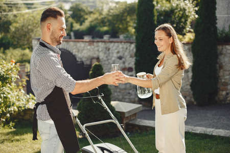 Lawn mower people working on the backyardの写真素材