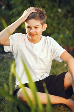 Little boy spend time at home in a backyardの写真素材