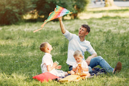Cute family playing in a summer fieldの写真素材