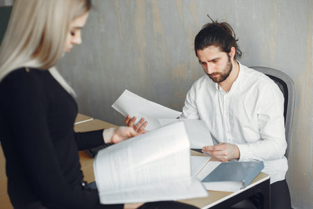 Stylish businessman with woman working at the office