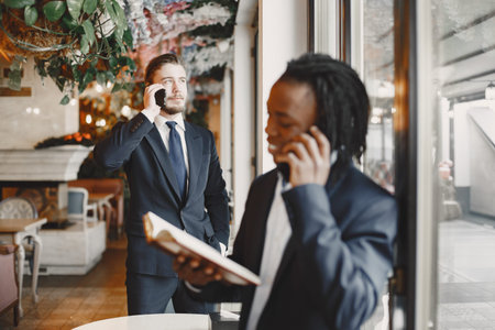 Two internatioal businessmen at the officeの写真素材