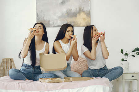 Girls friends have a pajama party at homeの写真素材