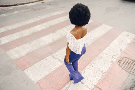 Portrait beautiful smiling african woman in city closeupの写真素材