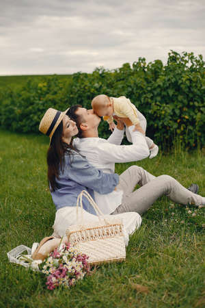 Cute family playing in a summer fieldの写真素材