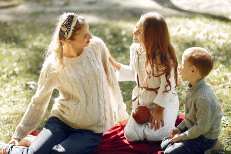 Mother with child with shopping bag in a cityの写真素材
