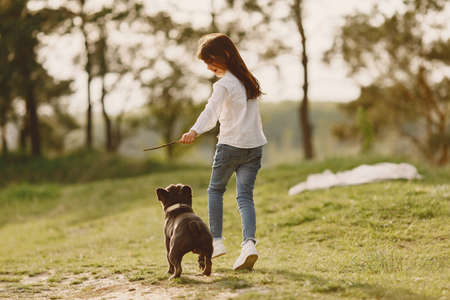 Portrait of a little girl with her beautiful dogの写真素材