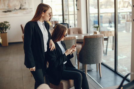 twins with phoneの写真素材