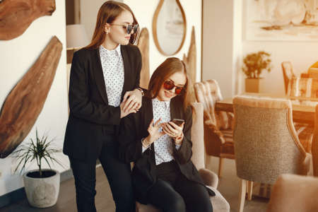 twins with phoneの写真素材